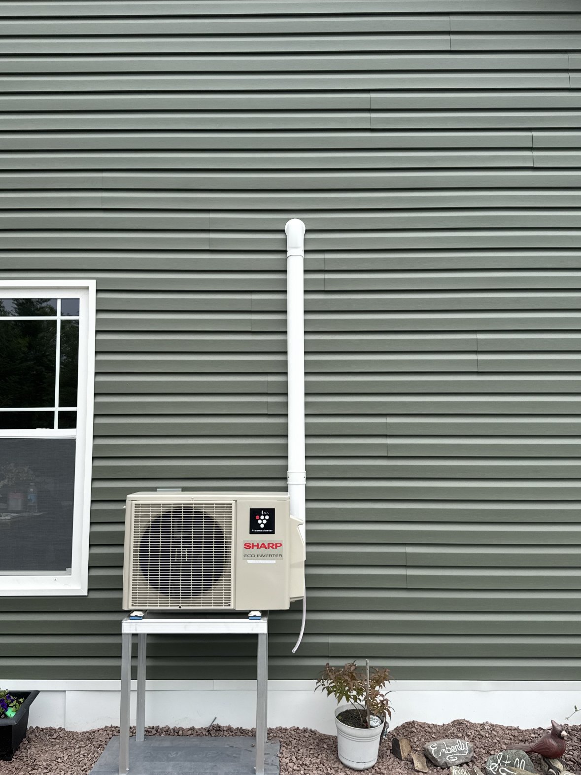 Ductless mini split heat pump exterior unit installation